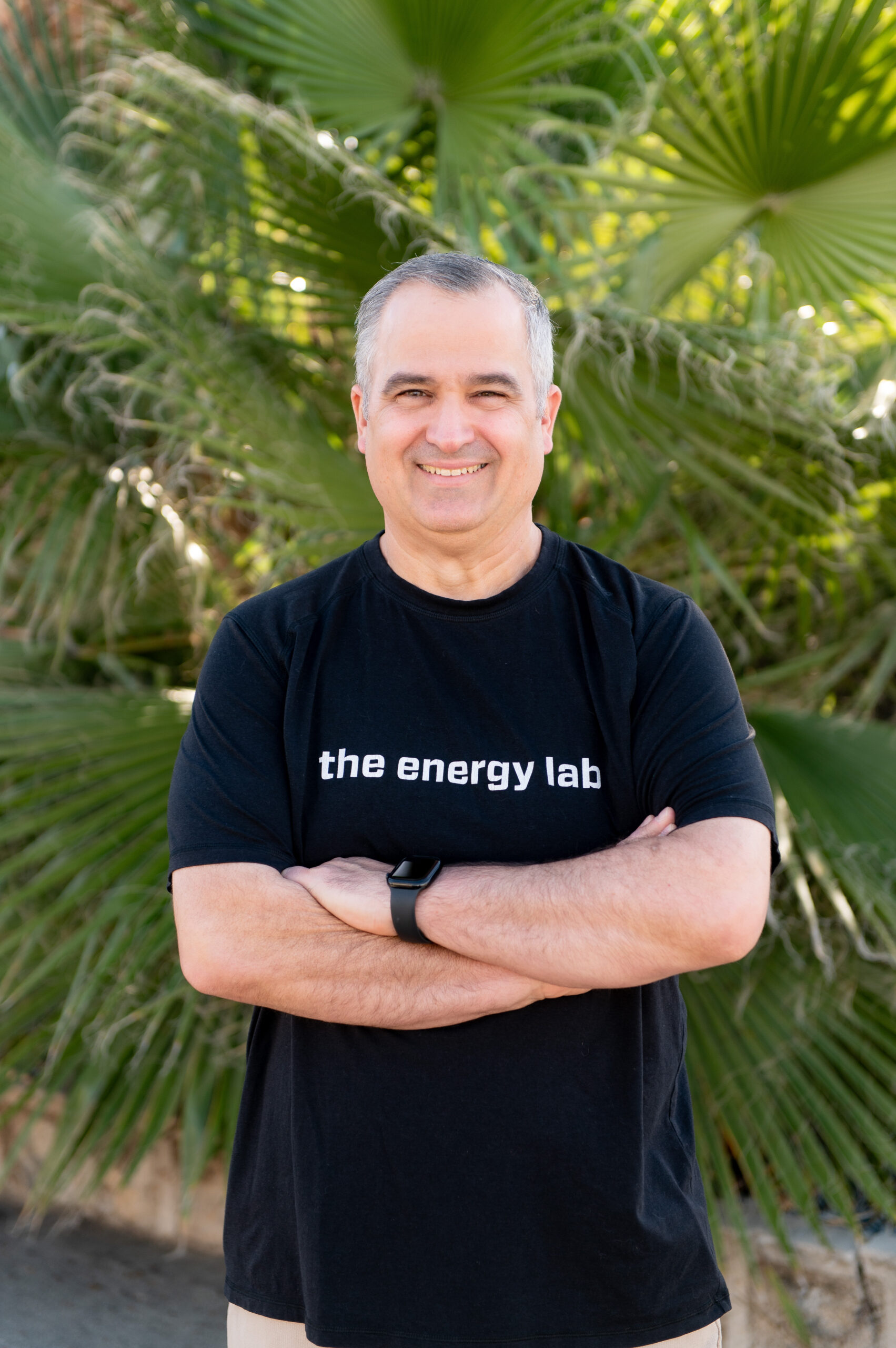 Sean in front of a palm tree at The Energy Lab in Redlands, CA.