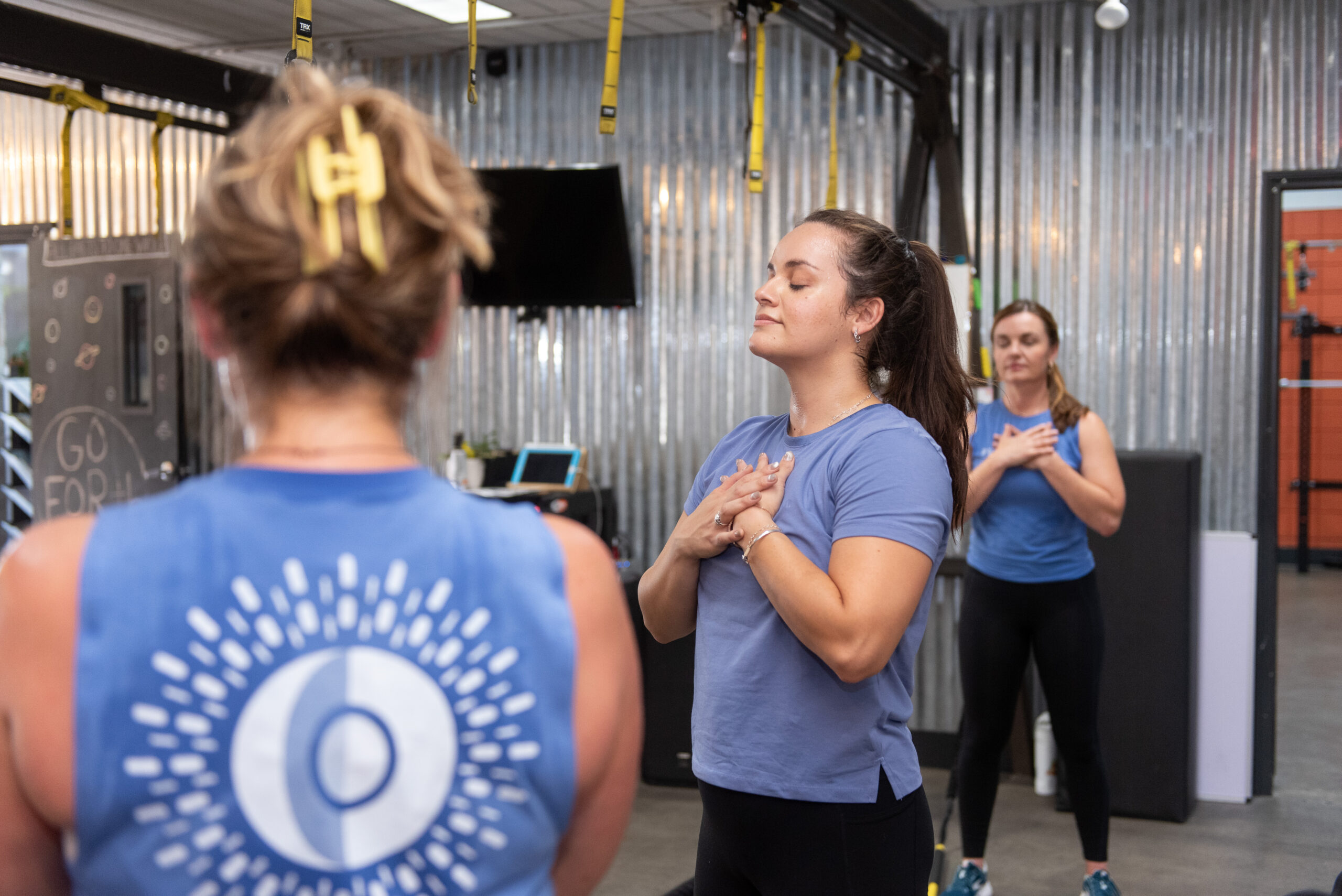 Jacquelyn taking a moment to meditate after a group fitness class at The Energy Lab in Redlands, CA.