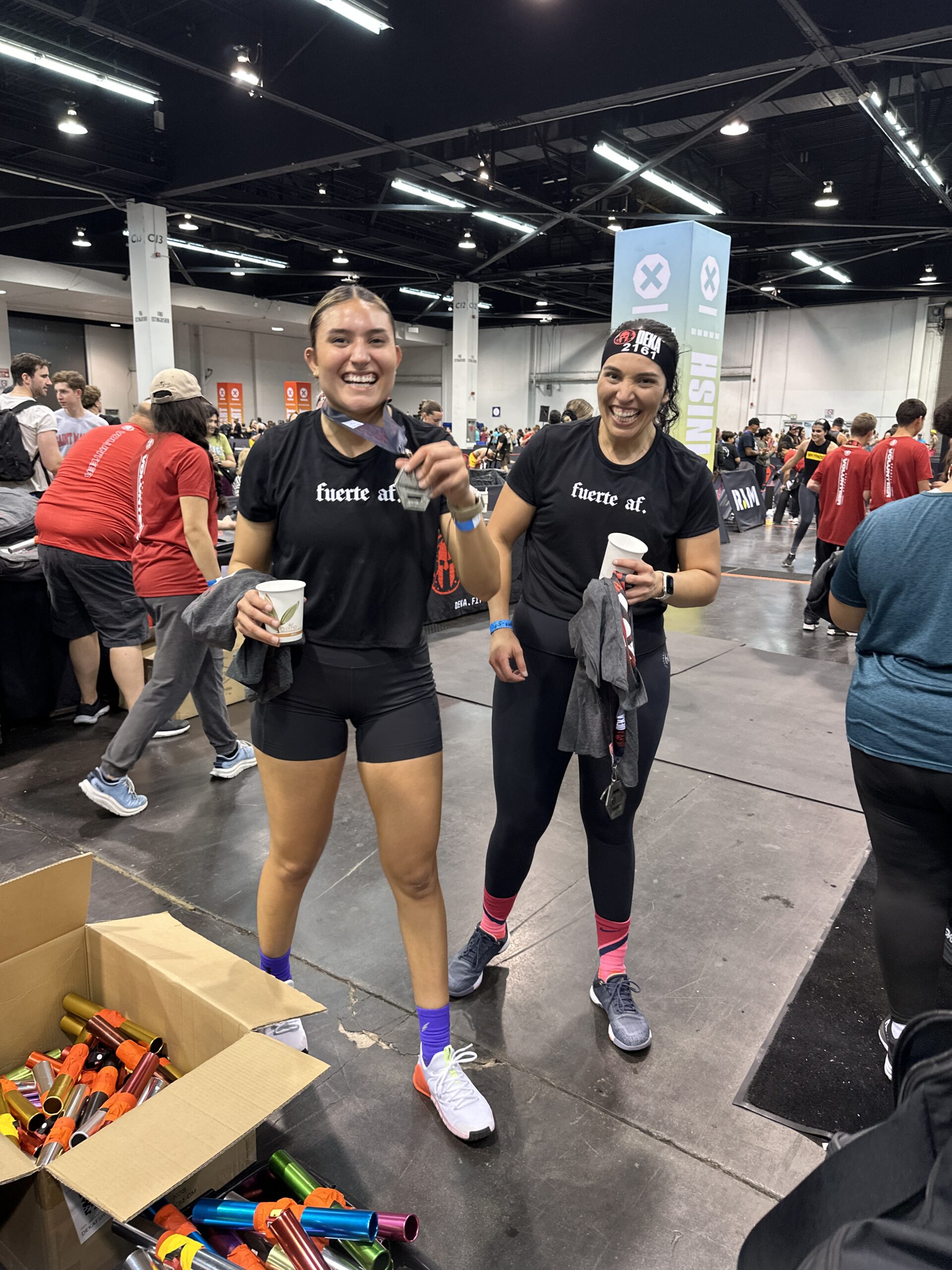 JJ celebrating with her sister after finishing a DEKA Fit competition with The Energy Lab.