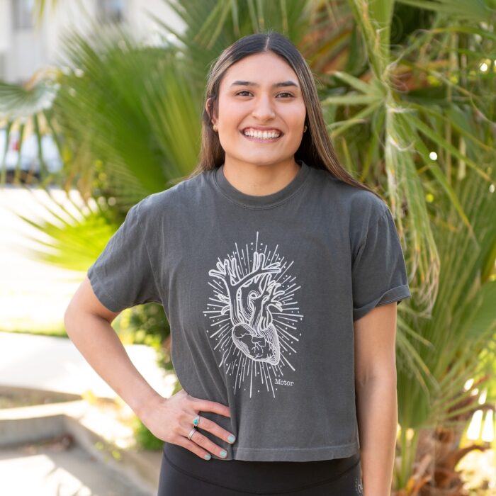 JJ standing in front of a tree at The Energy Lab in Redlands, CA. JJ is a personal trainer and group fitness instructor at The Energy Lab.