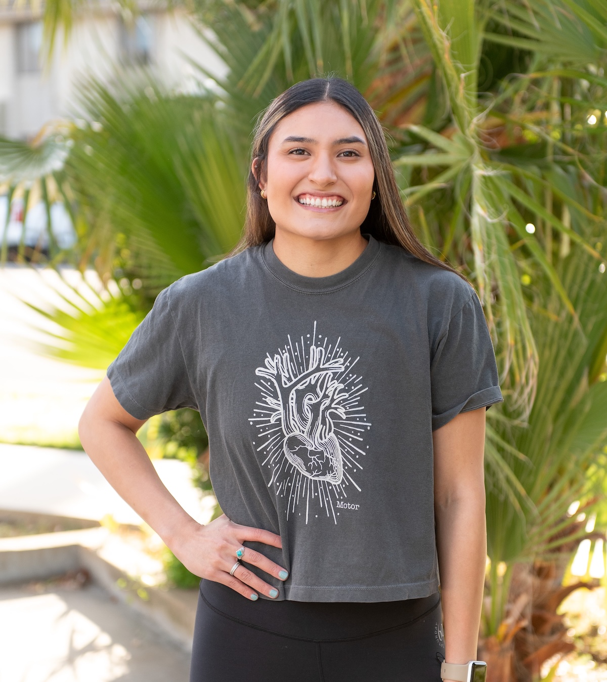 JJ standing in front of a tree at The Energy Lab in Redlands, CA. JJ is a personal trainer and group fitness instructor at The Energy Lab.