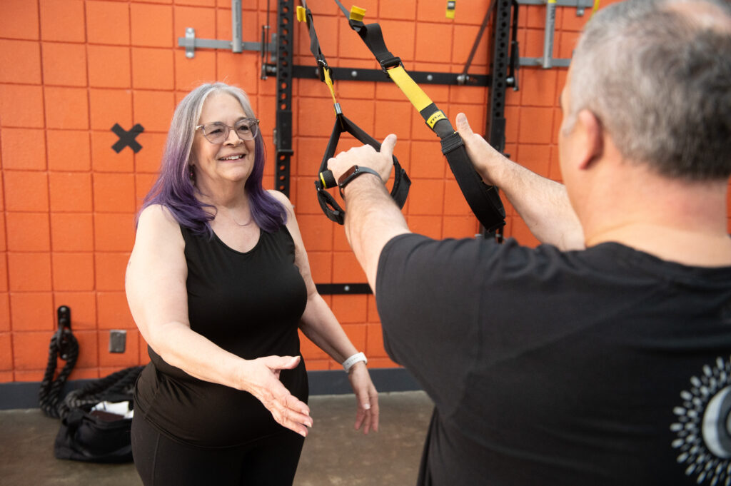 Germaine training a client during a personal training session at The Energy Lab in Redlands, CA.
