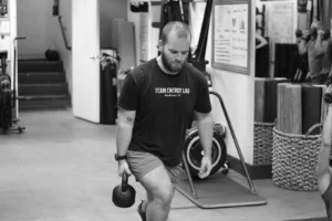 Tyler doing a reverse lunge during a circuit strength class at The Energy Lab in Redlands, CA.