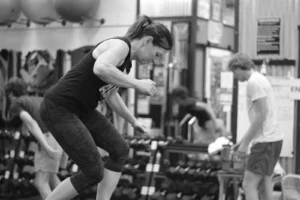 Heather doing a box step over during a Hybrid Training class at The Energy Lab in Redlands, CA.
